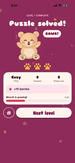 The puzzle solved screen with a cheering bear and a RAWR speech bubble